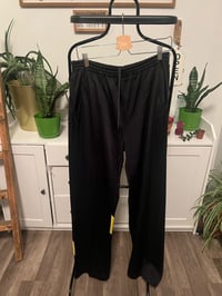 Image 1 of Black and yelllow stripe track pants 