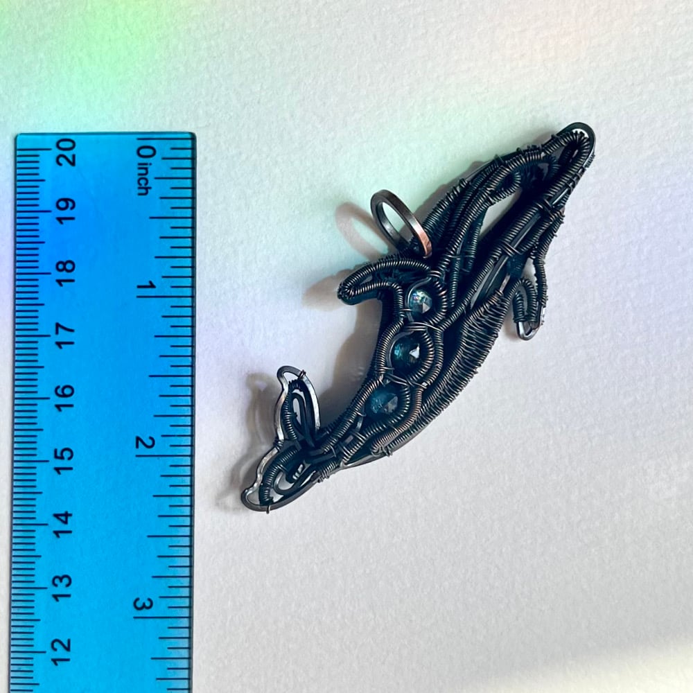 Image of Oceanborne Grace – Moss Kyanite Dolphin Pendant