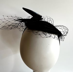 Image of Black felt button with bird