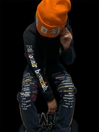 Embroidered Nudie Denim