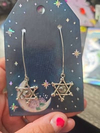 Star eye earrings
