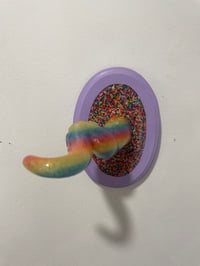 Image 1 of Uv reactive single tentacle in candy rainbow on lilac oval base with sprinkles 