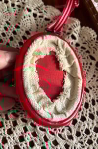 Image 2 of 3” Abstract ornament using red, green, and gold fibers 