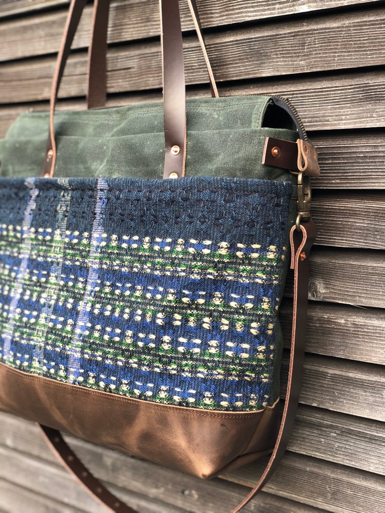Image of  Waxed canvas carryall with handwoven exterior pocket in forest green