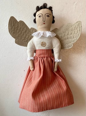 Image of A folk art angel in striped skirt