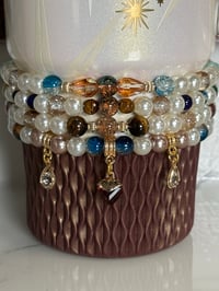 Image 1 of Starlight Shimmer Moon and Stars| Cream, Navy, and Gold  Tumbler Bracelet Stack