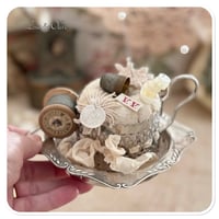 Image 2 of Handmade pin cushion sitting on a vintage silver style tray