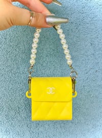 Image 1 of YELLOW CHANEL PURSE AIRPOD CASE