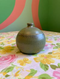 Image 1 of green jar