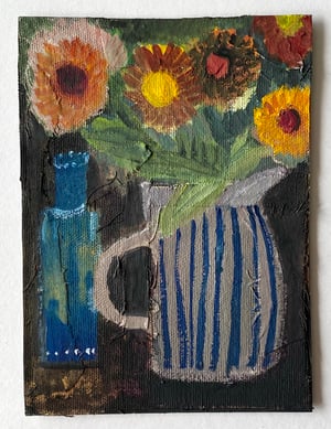 Image of striped jug with hot summer flowers