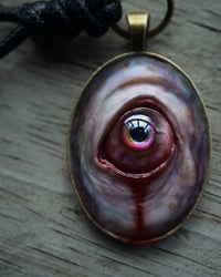 Image 1 of Color Shift Eye glow in the dark pendant OOAK