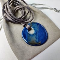 Image 2 of Flattened pebble cut-out pendant deep blue/bronze