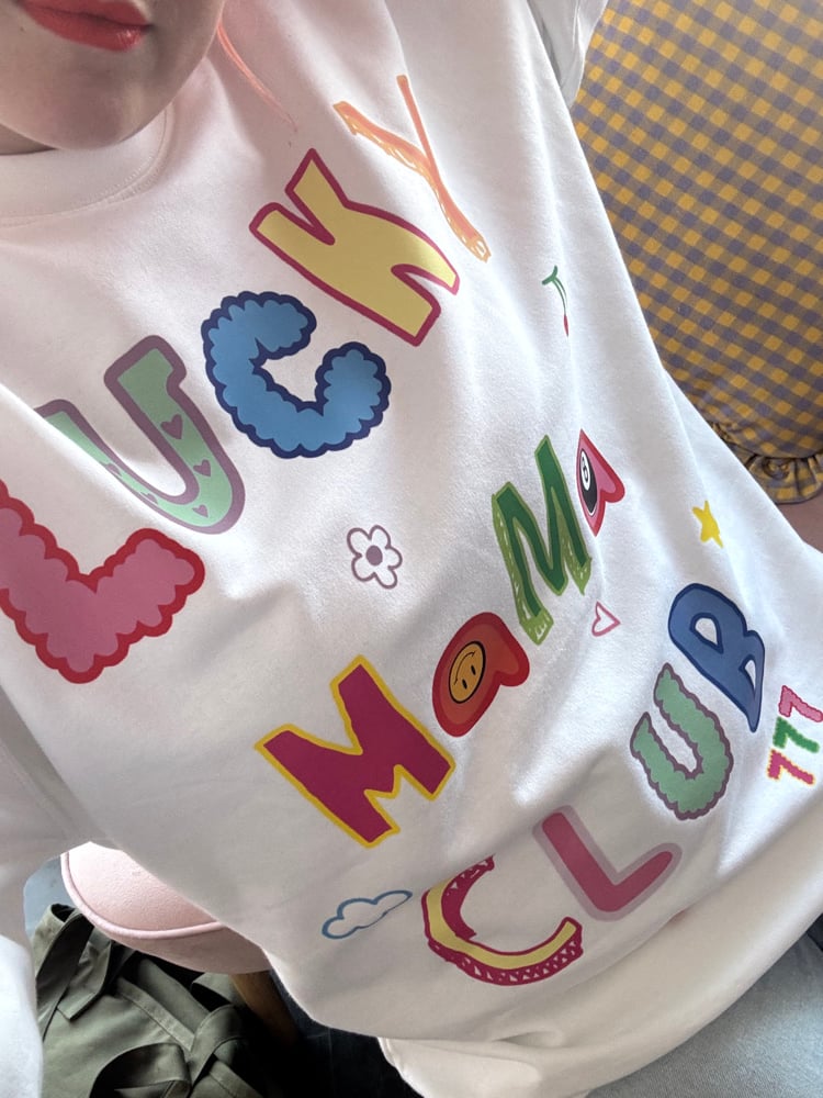 Image of the lucky club tees/sweater 