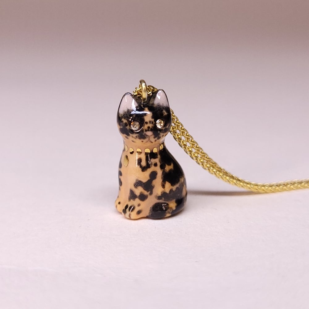 Image of Tortoiseshell Porcelain & Gold Vermeil Sitting Kitten Pendant