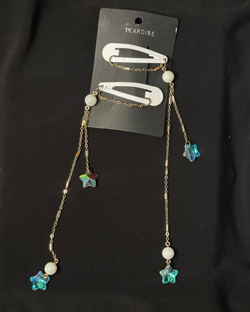 Image of white iridescent star clips 