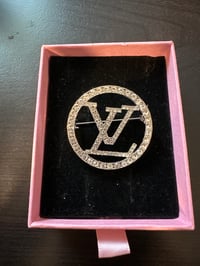 Silver LV brooch