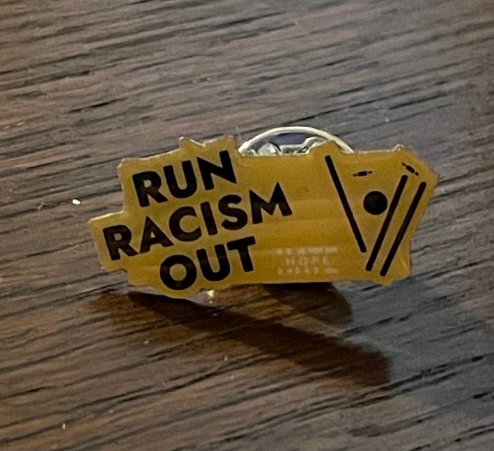 Run Racism Out! pin badge