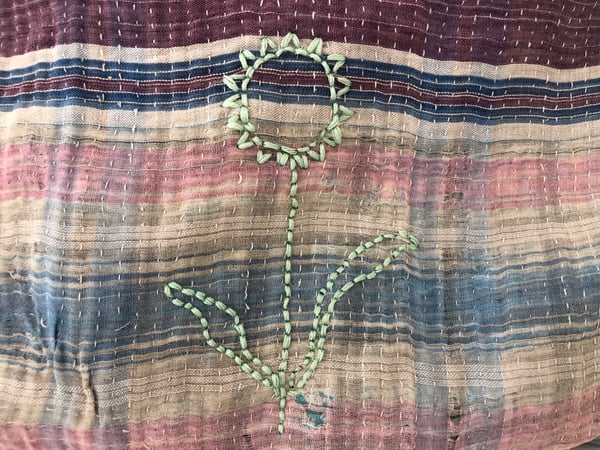 Image of mint flower on blue vintage kantha