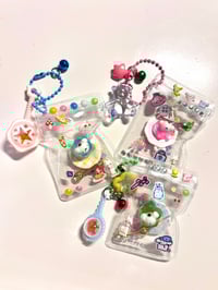 Image 1 of surprise shaker charm 