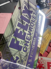 Image 1 of CHROME & PURPLE FELIX CHEVROLET ICONIC LICENSE PLATE l