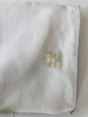 Image of moon pale lilac bag with ecru buttons