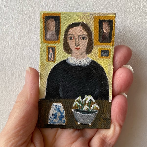 Image of Woman at a table with snowdrops - tiny painting 