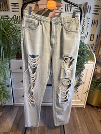 Image 1 of Light washed distressed denim jeans 