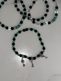 Image 2 of Teal and Black Midnight Glitz’s Tumbler Bracelet Stack