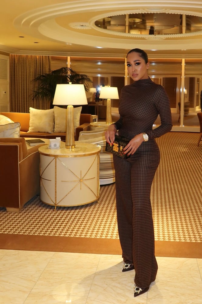 Image of HOUNDSTOOTH PRINT MOCK NECK FLARED JUMPSUIT (XS)