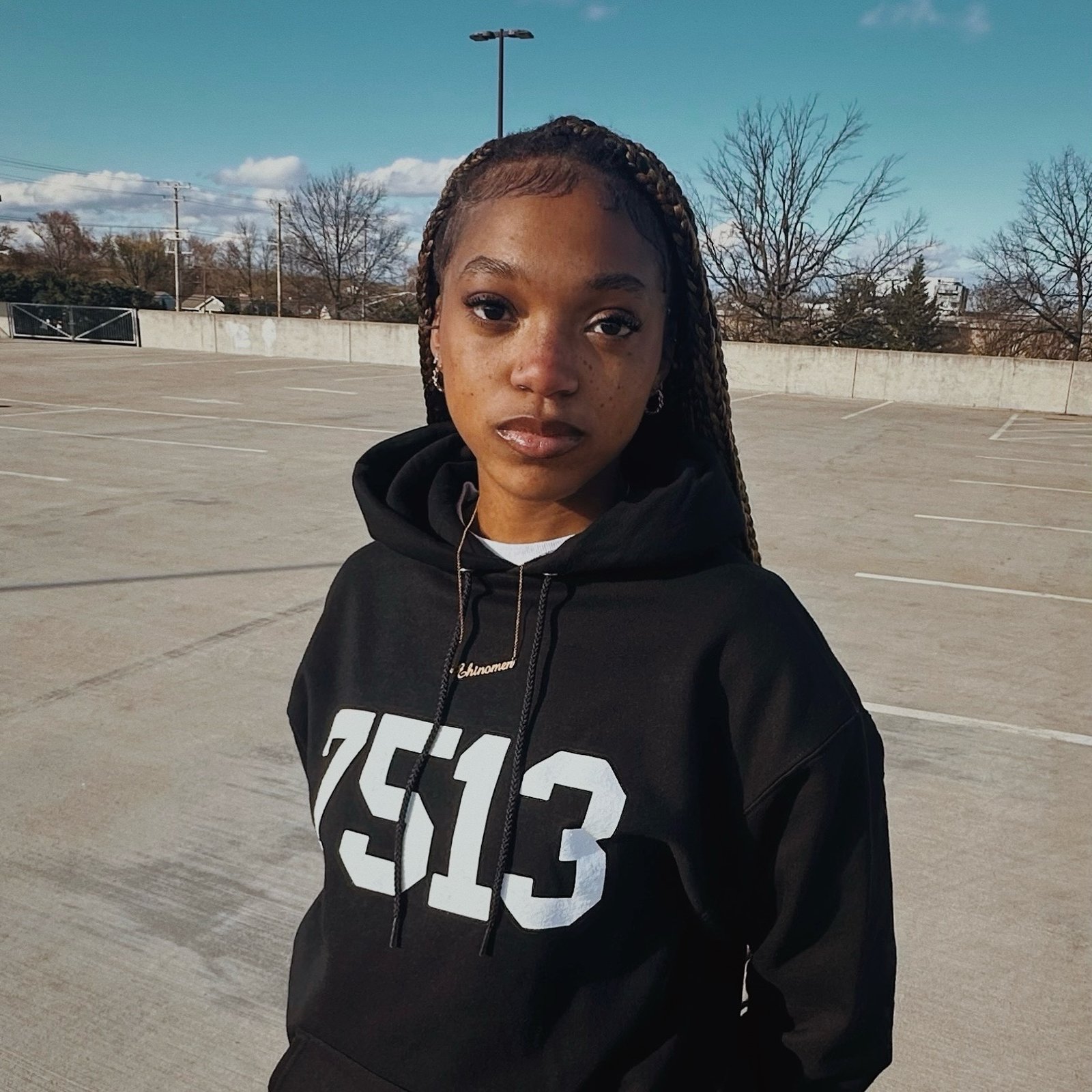 Black “7513” Champion Hoodie | LUVZAAMWÉ