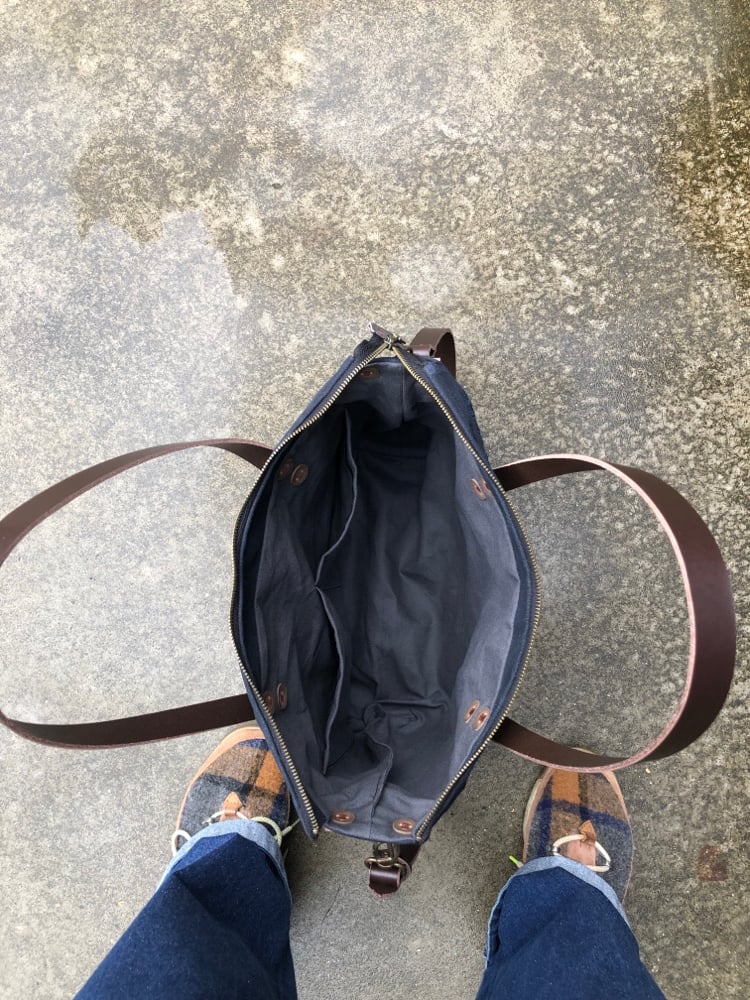 Image of Black Waxed canvas carryall with handwoven exterior pocket 