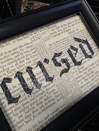 Image 1 of "Cursed" 1800's bible page with preserved spider web  