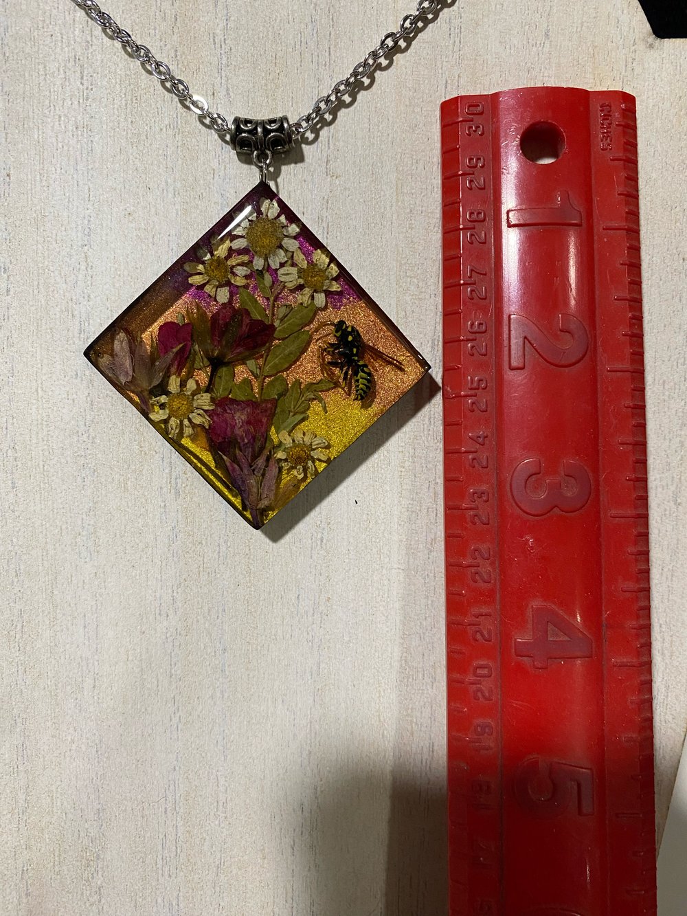 Wasp floral scene pendant 