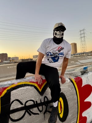 Image of bleed blue T