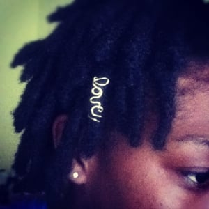 Image of "Love" word loc charm