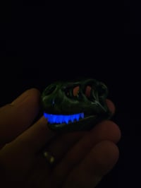 Image 4 of Chromium T-Rex skull pendant with glowin glass glow in the dark teeth.