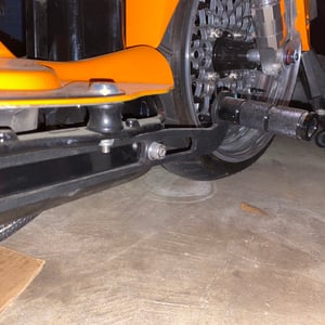 Image of Honda Ruckus front peg brackets with VIN window
