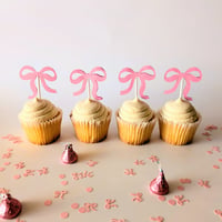 Image 1 of Moños Coquete Rosa Cupcake Toppers Sets de 12 y 24