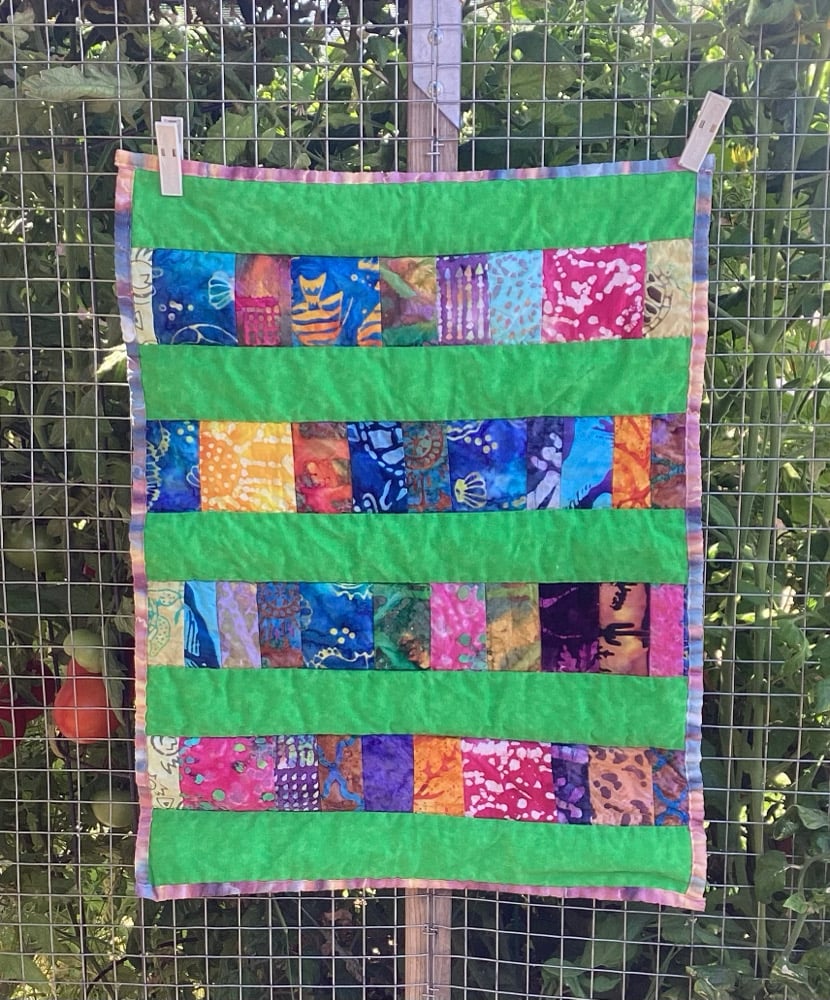 Image of Scrappy Batik Cat Quilt