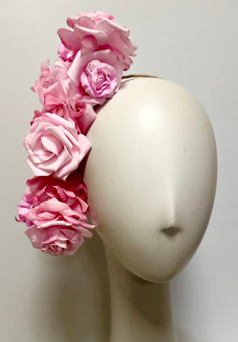 Image of Soft pink flower headpiece. 