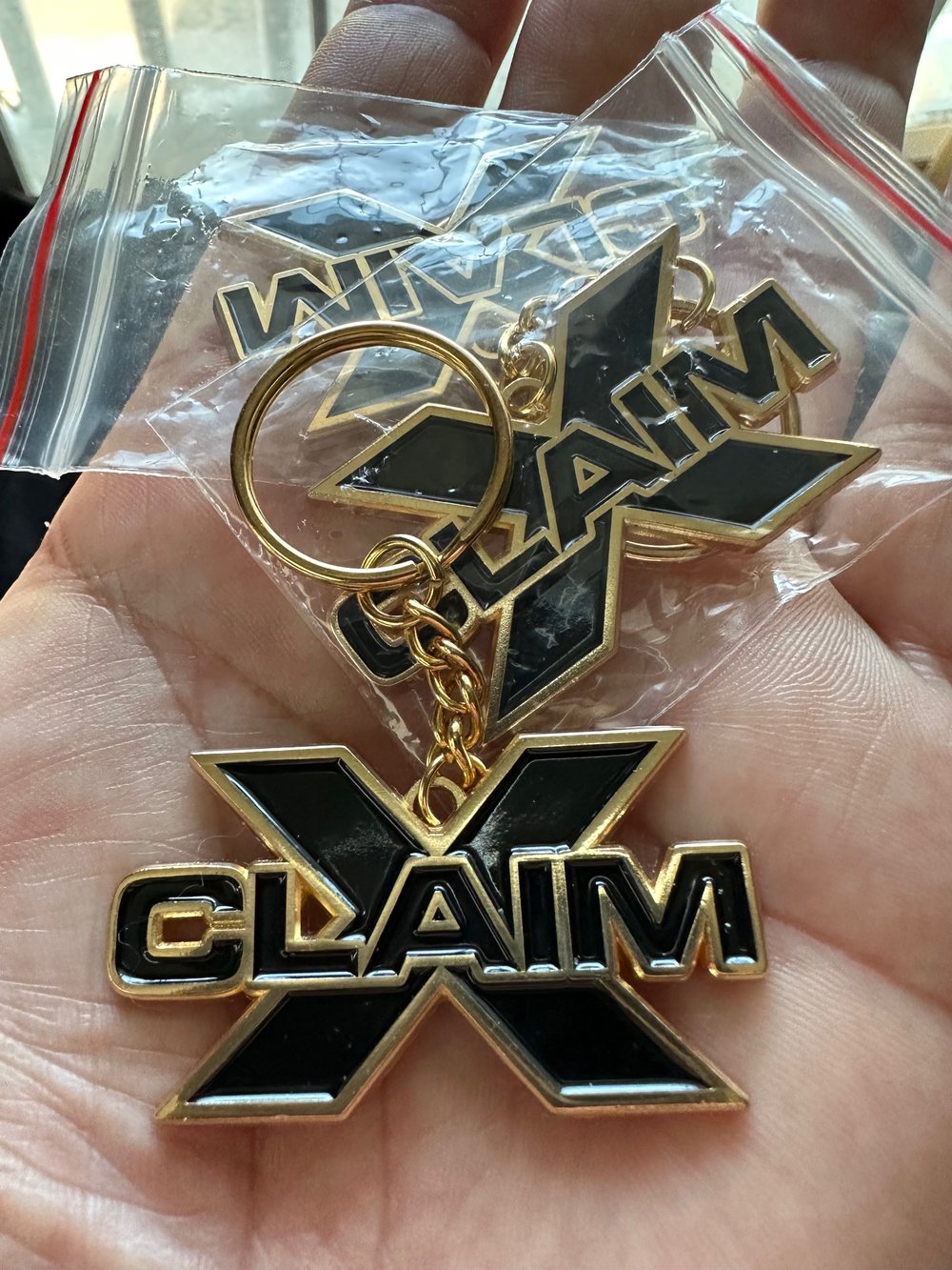 Shiny Gold “xclaim" logo metal Keychain