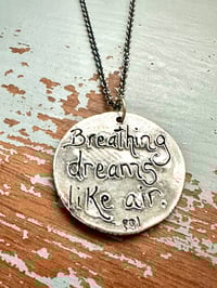 Image 11 of blue sapphire pendant with Fitzgerald quote