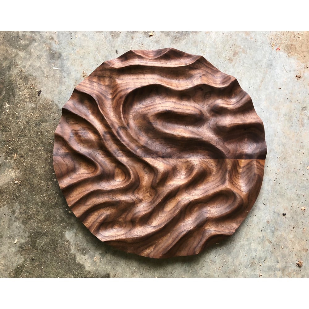 Image of Mudslide. Walnut carving