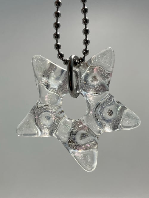 Image of dicro star with tektite incasment (collab with Wallander glass)
