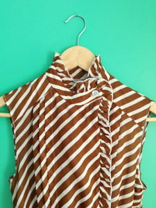 Image of Brown & white striped dress with peplum & pleats