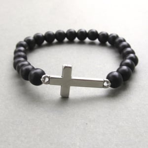 Image of Black beaded stretch bracelet with sideways cross