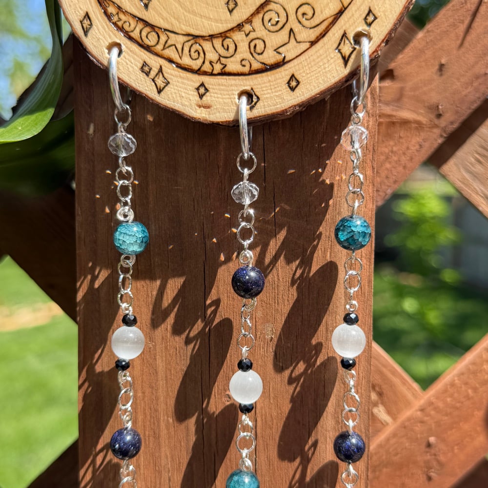 Image of face in the moon sun catcher 