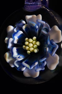 Image 4 of blue daisy flower pendant made by Roe glass. 