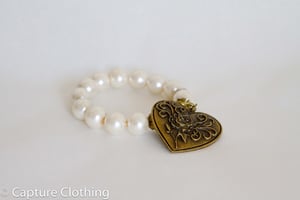 Image of Pearl bracelet with heart pendant