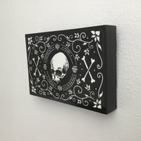 Image 3 of Skull And Scrolls Linocut Print On Wooden Panel